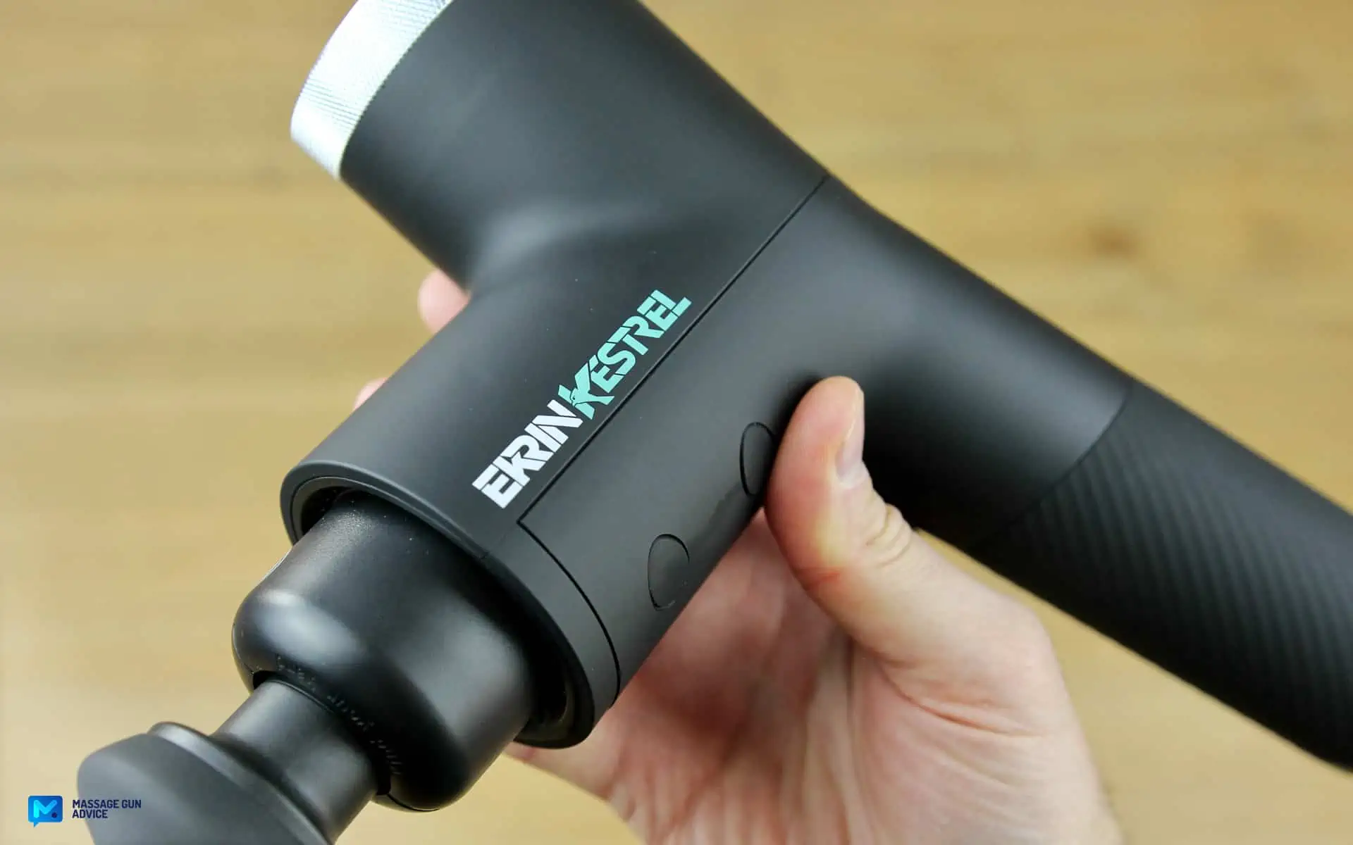 Ekrin Kestrel Review - Is This the Ultimate Massage Gun Unicorn? 13 ekrin kestrel side held by a hand