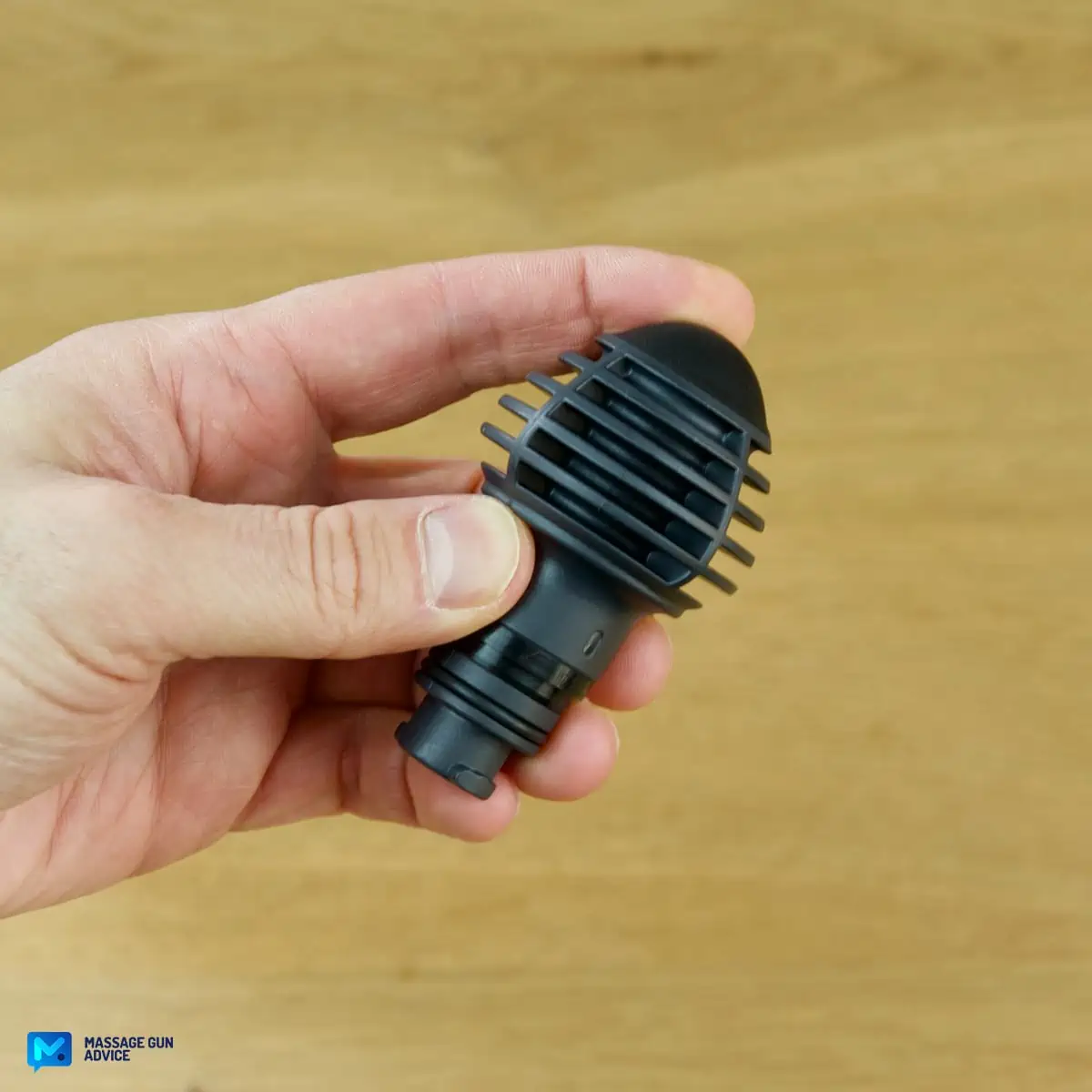 Ekrin Kestrel Review - Is This the Ultimate Massage Gun Unicorn? 25 A hand holding an Ekrin Kestrel massage gun attachment known as Cone head - a finger is pressing the head
