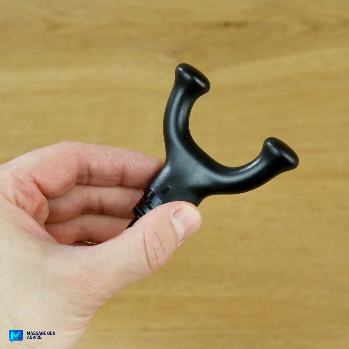 Ekrin Kestrel Review - Is This the Ultimate Massage Gun Unicorn? 26 A hand holding an Ekrin Kestrel massage gun attachment known as Fork Head