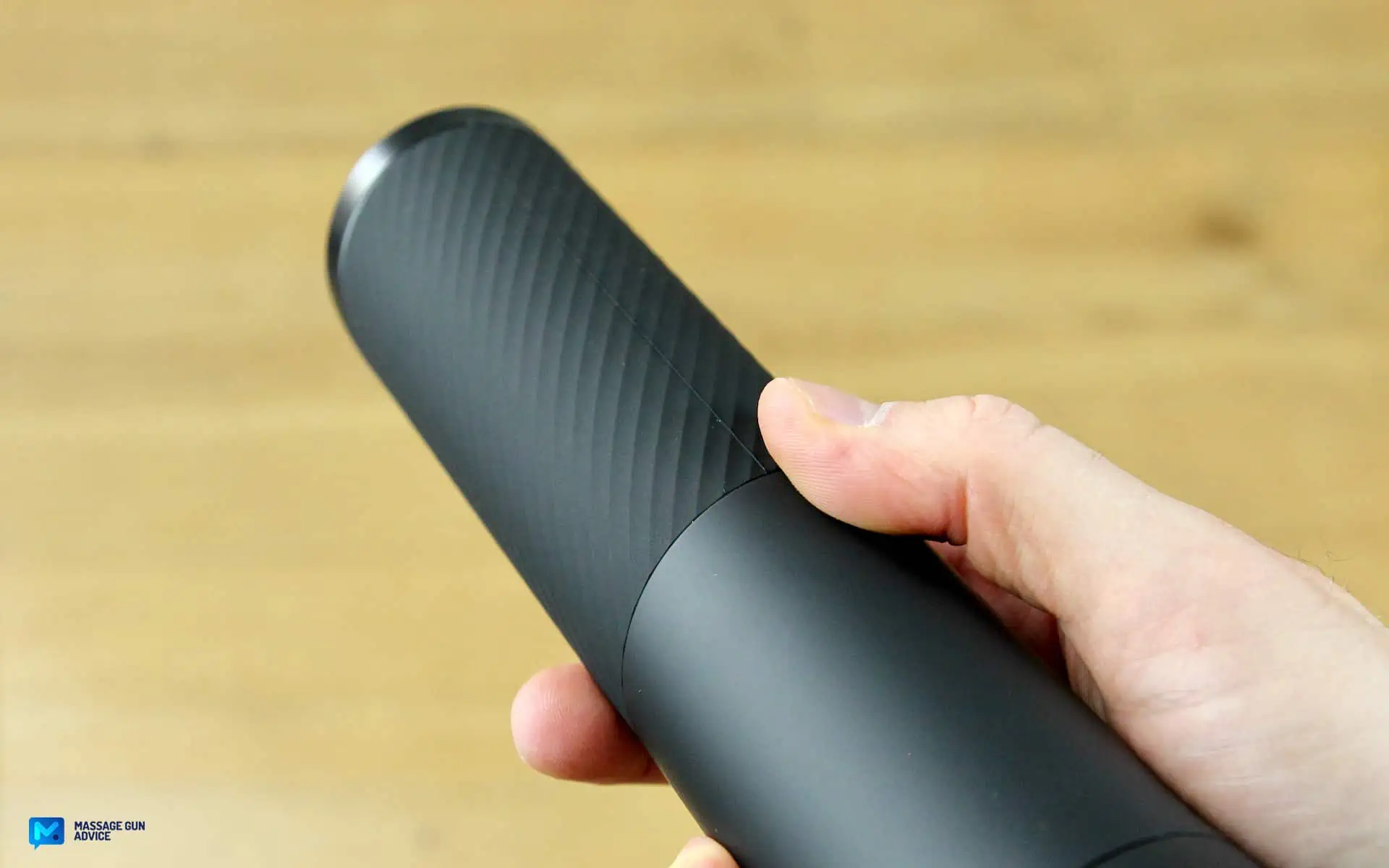 Ekrin Kestrel Review - Is This the Ultimate Massage Gun Unicorn? 19 Ekrin Kestrel's handle showing its New Textured Rubberized surface For Better Grip