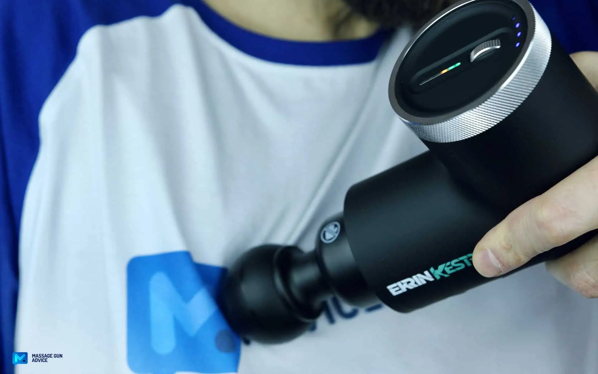 Ekrin Kestrel Review - Is This the Ultimate Massage Gun Unicorn? 39 ekrin Kestrel working on a man's chest.