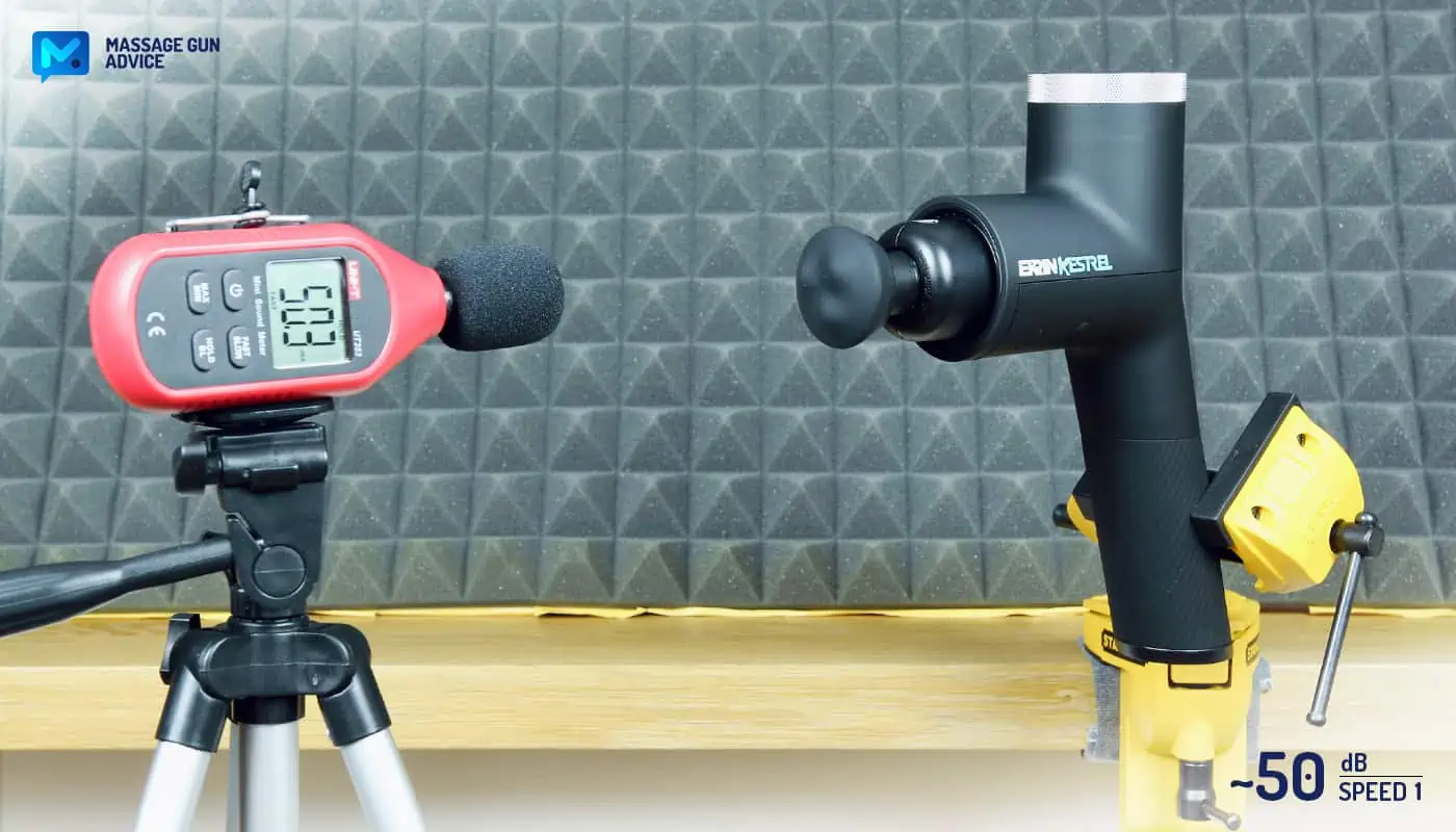 Ekrin Kestrel Review - Is This the Ultimate Massage Gun Unicorn? 33 Ekrin Kestrel review: clamped to a table while operating at its lowest speed. Opposite to it, a digital noise device measuring decibels
