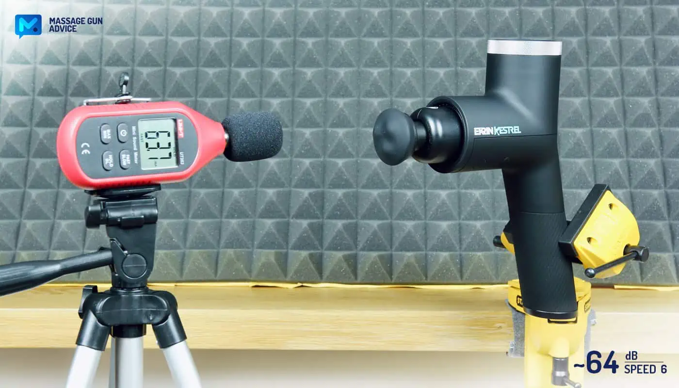 Ekrin Kestrel Review - Is This the Ultimate Massage Gun Unicorn? 34 Ekrin Kestrel review: clamped to a table while operating at its highest speed. Opposite to it, a digital noise device measuring decibels