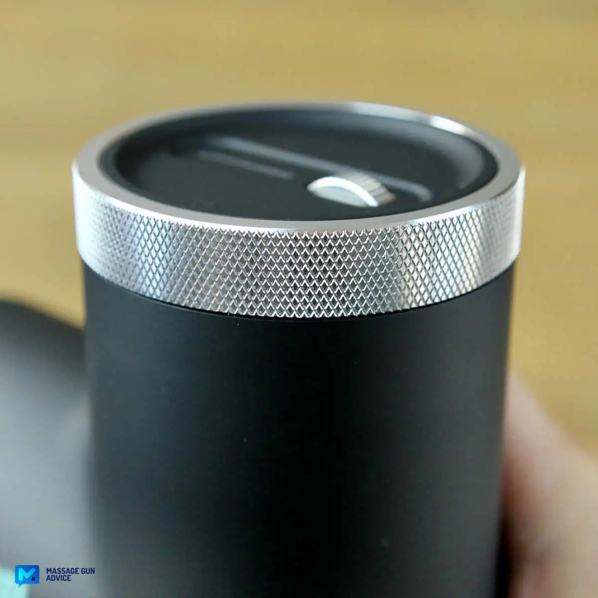 Ekrin Kestrel Review - Is This the Ultimate Massage Gun Unicorn? 11 Metal Chrome Bezel on the top of the Ekrin Kestrel massage gun