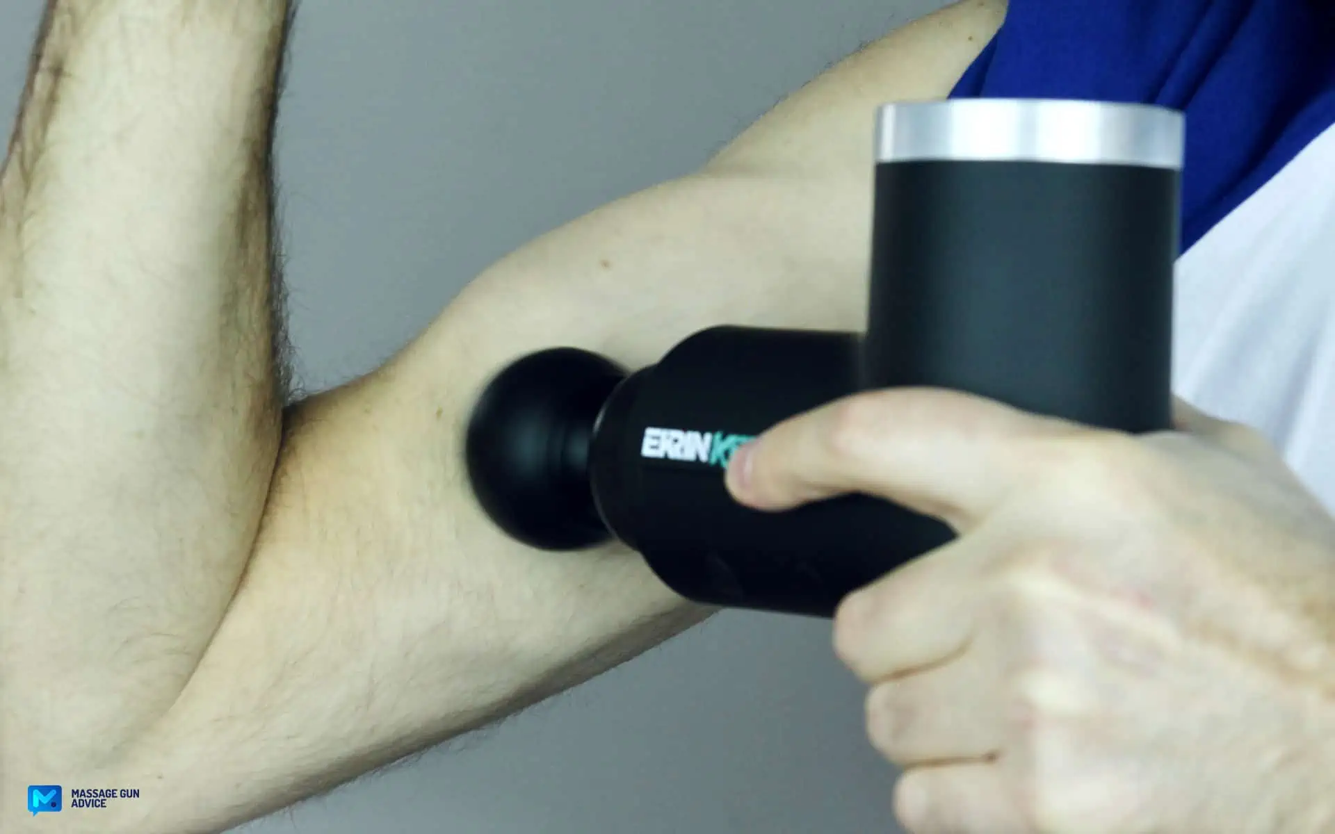 Ekrin Kestrel Review - Is This the Ultimate Massage Gun Unicorn? 42 ekrin Kestrel used On a man's Biceps Muscle