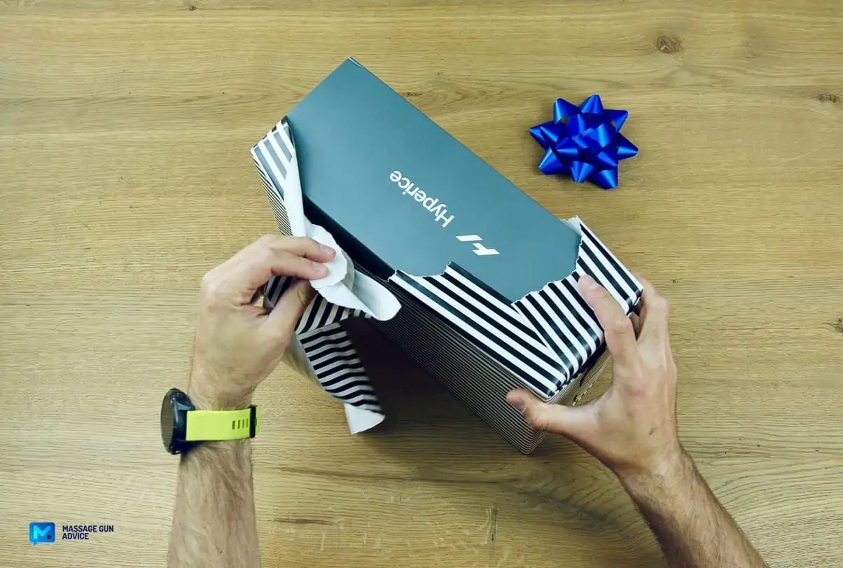 Tech Gifts: Are Massage Guns Good Gift Ideas? - Guide 2026 24 hands unwrapping gift; hyperice; hypervolt; secret santa gift ideas, valentines gift for her