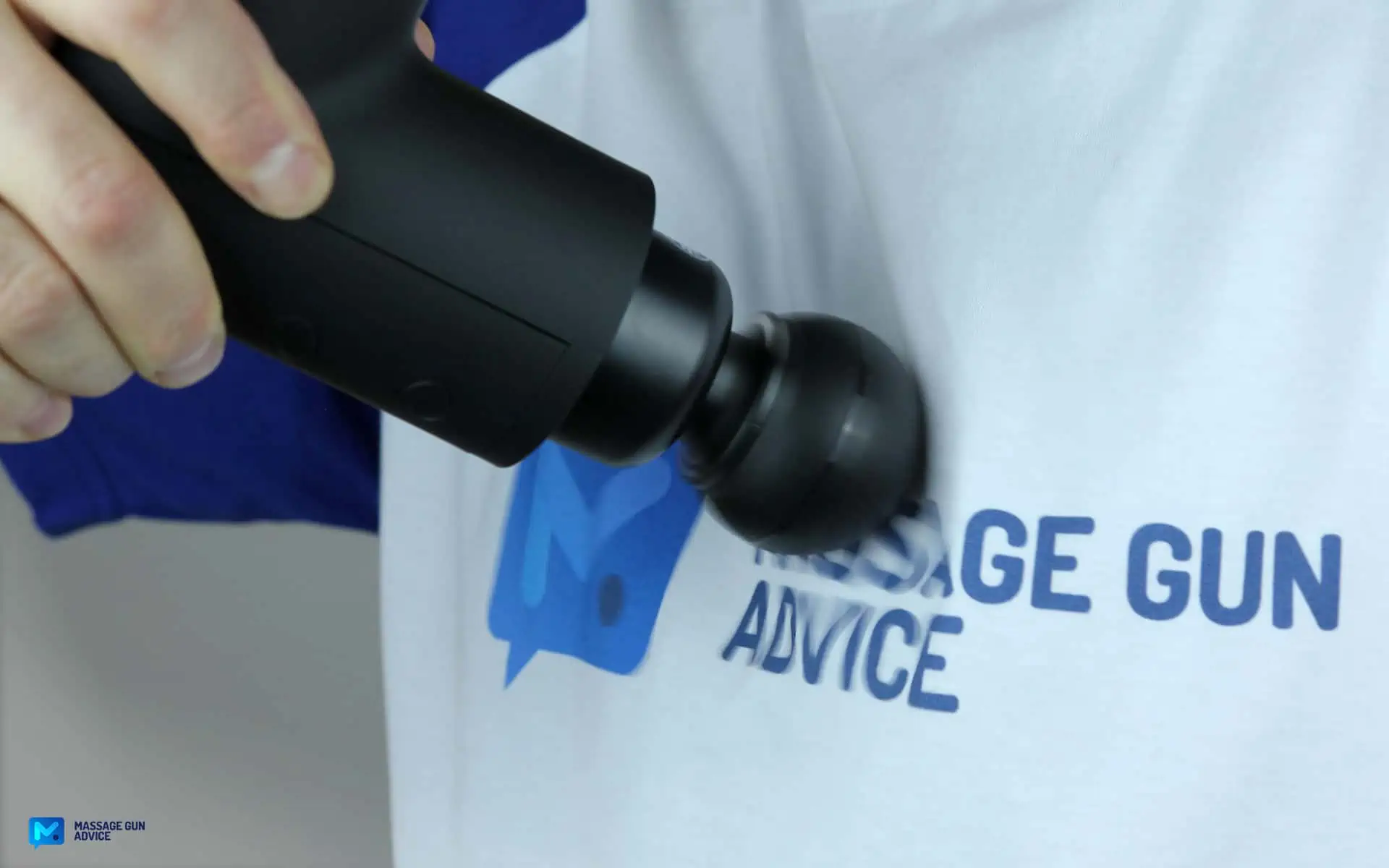 Ekrin Kestrel Review - Is This the Ultimate Massage Gun Unicorn? 40 ekrin Kestrel review: working on a man's chest from a different angle