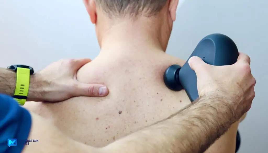 What Toxins Are Released After Massage? Demystifying Detoxification 8 body waste removal: massage gun on back of a senior